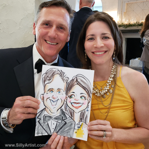 couple holding their caricature in a wedding in austin