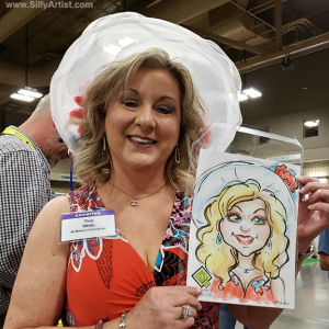 woman holding her trade show caricature in austin silly artist