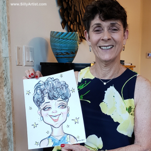 woman holding a caricature at a birthday party in Austin silly artist