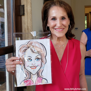 woman holding a caricature at a birthday party in Austin silly artist