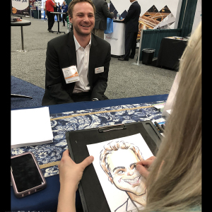 Drawing caricatures at convention in Austin artist 